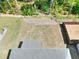 Aerial view of a flat backyard with a wooden fence and freshly cut grass at 1673 Dover Creek Ln, Lawrenceville, GA 30045