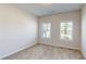 Comfortable bedroom with carpeted flooring and bright windows offering natural light at 1673 Dover Creek Ln, Lawrenceville, GA 30045