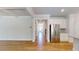 Open-concept floorplan featuring a hallway and kitchen with stainless steel appliances at 1673 Dover Creek Ln, Lawrenceville, GA 30045