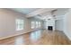 Bright living room with coffered ceilings, hardwood floors, and a cozy fireplace at 1673 Dover Creek Ln, Lawrenceville, GA 30045