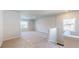 Spacious carpeted bonus room with windows for natural light; perfect for entertaining at 1673 Dover Creek Ln, Lawrenceville, GA 30045