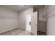 Walk-in closet with carpeted floor, open door to bathroom, and metal shelving at 1673 Dover Creek Ln, Lawrenceville, GA 30045