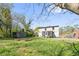Spacious backyard featuring a shed, garden beds, and lush green grass, perfect for outdoor activities at 1952 Don Juan Ln, Decatur, GA 30032