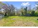 Expansive backyard with lush greenery, a storage shed, and garden beds, offering privacy and space at 1952 Don Juan Ln, Decatur, GA 30032