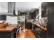 Modern kitchen featuring dark cabinets, butcher block countertops, stainless steel appliances, and stylish backsplash at 1952 Don Juan Ln, Decatur, GA 30032