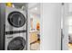 Washer and dryer outside a bathroom area. Functional utility and design in one space at 1952 Don Juan Ln, Decatur, GA 30032