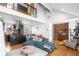 Open concept living room with modern furnishings, hardwood floors, and a stylish kitchen, all under a vaulted ceiling at 1952 Don Juan Ln, Decatur, GA 30032