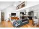Bright, open-concept living area with hardwood floors, a soaring ceiling, and a modern kitchen at 1952 Don Juan Ln, Decatur, GA 30032