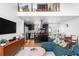 Spacious living area with open layout, showcasing hardwood floors, modern kitchen, and unique loft design at 1952 Don Juan Ln, Decatur, GA 30032
