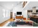Bright living room featuring hardwood floors, modern furnishings, and a stylish open floor plan, with vaulted ceilings at 1952 Don Juan Ln, Decatur, GA 30032