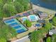 Aerial view of neighborhood amenities: pool, tennis courts, playground and clubhouse at 440 Hunt River Way, Suwanee, GA 30024
