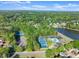 Panoramic view showcasing neighborhood amenities, a lake and residential areas at 440 Hunt River Way, Suwanee, GA 30024