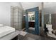 Modern bathroom featuring unique tile work, dual sinks, and walk-in shower at 440 Hunt River Way, Suwanee, GA 30024