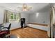 Bonus room boasts hardwood floors, natural light, and plenty of space for activities at 440 Hunt River Way, Suwanee, GA 30024