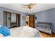 Bedroom shows closet organizer, crib, hardwood floors, and modern paint at 440 Hunt River Way, Suwanee, GA 30024