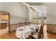 Dining area with hardwood floors offering views into the living room and kitchen at 440 Hunt River Way, Suwanee, GA 30024