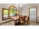 Bright dining area with large windows offering natural light and views to the deck at 440 Hunt River Way, Suwanee, GA 30024