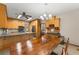 The Kitchen features light colored cabinets, stainless steel appliances and flows into the dining area at 440 Hunt River Way, Suwanee, GA 30024