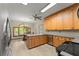Bright kitchen with stainless steel appliances and breakfast nook overlooking backyard at 440 Hunt River Way, Suwanee, GA 30024