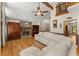 Spacious living room features hardwood floors, stone fireplace, and vaulted ceiling at 440 Hunt River Way, Suwanee, GA 30024