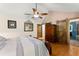 Large main bedroom with vaulted ceilings, hardwood floors, and ensuite bath access at 440 Hunt River Way, Suwanee, GA 30024