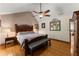 Large main bedroom with vaulted ceilings, a ceiling fan, and hardwood floors at 440 Hunt River Way, Suwanee, GA 30024