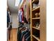 Well-organized walk-in closet with custom shelving and plenty of storage space at 440 Hunt River Way, Suwanee, GA 30024