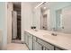Bathroom featuring double sink vanity, large mirror, and a shower behind a curtain at 1206 Parkwood Chase, Acworth, GA 30102