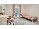 Bright bedroom featuring carpet flooring, desk, and a window with backyard view at 1206 Parkwood Chase, Acworth, GA 30102
