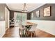 Inviting dining room with modern lighting, stylish decor, and easy access to outdoor space at 1206 Parkwood Chase, Acworth, GA 30102