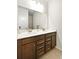 Bathroom featuring double sinks, a large mirror, and tiled floors at 1318 Crestwind Nw Rd, Kennesaw, GA 30152