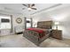Bright bedroom with a tray ceiling, ceiling fan, large windows, and neutral décor at 1318 Crestwind Nw Rd, Kennesaw, GA 30152