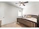 Simple bedroom with a ceiling fan, lots of natural light, and carpeted floor at 1318 Crestwind Nw Rd, Kennesaw, GA 30152