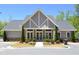 A charming clubhouse featuring a stone facade, manicured landscaping, and an inviting entrance at 1318 Crestwind Nw Rd, Kennesaw, GA 30152
