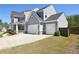 Charming two-story home with a three-car garage and craftsman-style details, great curb appeal at 1318 Crestwind Nw Rd, Kennesaw, GA 30152