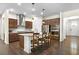 Modern kitchen features dark cabinets, stainless steel appliances, granite countertops, and a breakfast bar at 1318 Crestwind Nw Rd, Kennesaw, GA 30152