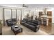 Bright, open-concept living space with seamless flow to the kitchen and a modern seating arrangement at 1318 Crestwind Nw Rd, Kennesaw, GA 30152