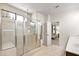 Large walk-in shower featuring glass enclosure, a bench, and tiled walls at 1318 Crestwind Nw Rd, Kennesaw, GA 30152