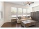 Inviting sun room featuring large windows, hardwood floors, neutral paint and comfortable furniture at 1318 Crestwind Nw Rd, Kennesaw, GA 30152
