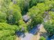 Aerial view displaying the home nestled among mature trees in a desirable neighborhood at 4505 Glengary Ne Dr, Atlanta, GA 30342