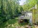Spacious backyard with a deck perfect for entertaining, lush green lawn, and mature trees at 4505 Glengary Ne Dr, Atlanta, GA 30342