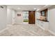 Finished basement with stylish herringbone floors, a window seat, and a view into the adjacent bedroom at 4505 Glengary Ne Dr, Atlanta, GA 30342