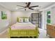 Comfortable bedroom with a ceiling fan, bookshelf, and a light green bed frame at 4505 Glengary Ne Dr, Atlanta, GA 30342