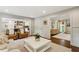 Open-concept living room with views into the kitchen, hardwood floors, and neutral tones at 4505 Glengary Ne Dr, Atlanta, GA 30342
