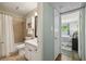 Updated bathroom with a shower-tub, white vanity, and tiled floors at 5400 Roswell Rd # H5, Atlanta, GA 30342