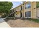 Exterior view of building with brick facade, stairs, and lush landscaping at 5400 Roswell Rd # H5, Atlanta, GA 30342