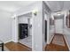 Inviting hallway with hardwood floors, leading to kitchen view and other rooms at 5400 Roswell Rd # H5, Atlanta, GA 30342
