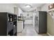 Well-lit kitchen with white cabinets and stainless steel appliances at 5400 Roswell Rd # H5, Atlanta, GA 30342
