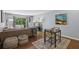 Cozy living room featuring a comfortable sofa, stylish rug, and a small dining table at 5400 Roswell Rd # H5, Atlanta, GA 30342