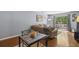 Comfortable living room featuring hardwood floors and a sliding glass door to a patio at 5400 Roswell Rd # H5, Atlanta, GA 30342